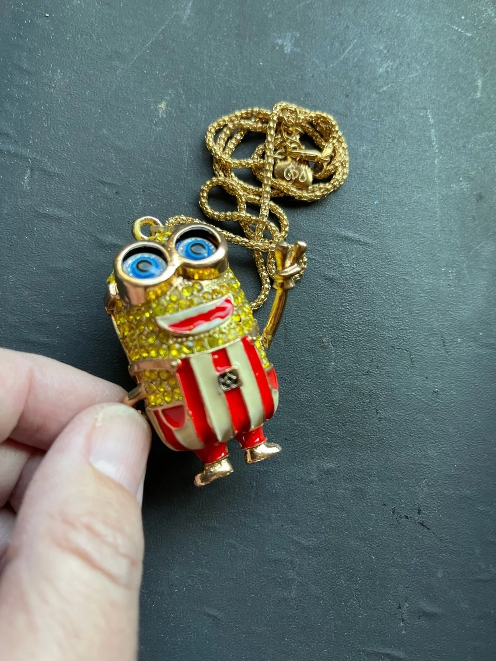 Minion Crystal Yellow Pendant with Red Stripe Overalls. His  Arms Move. NWOT